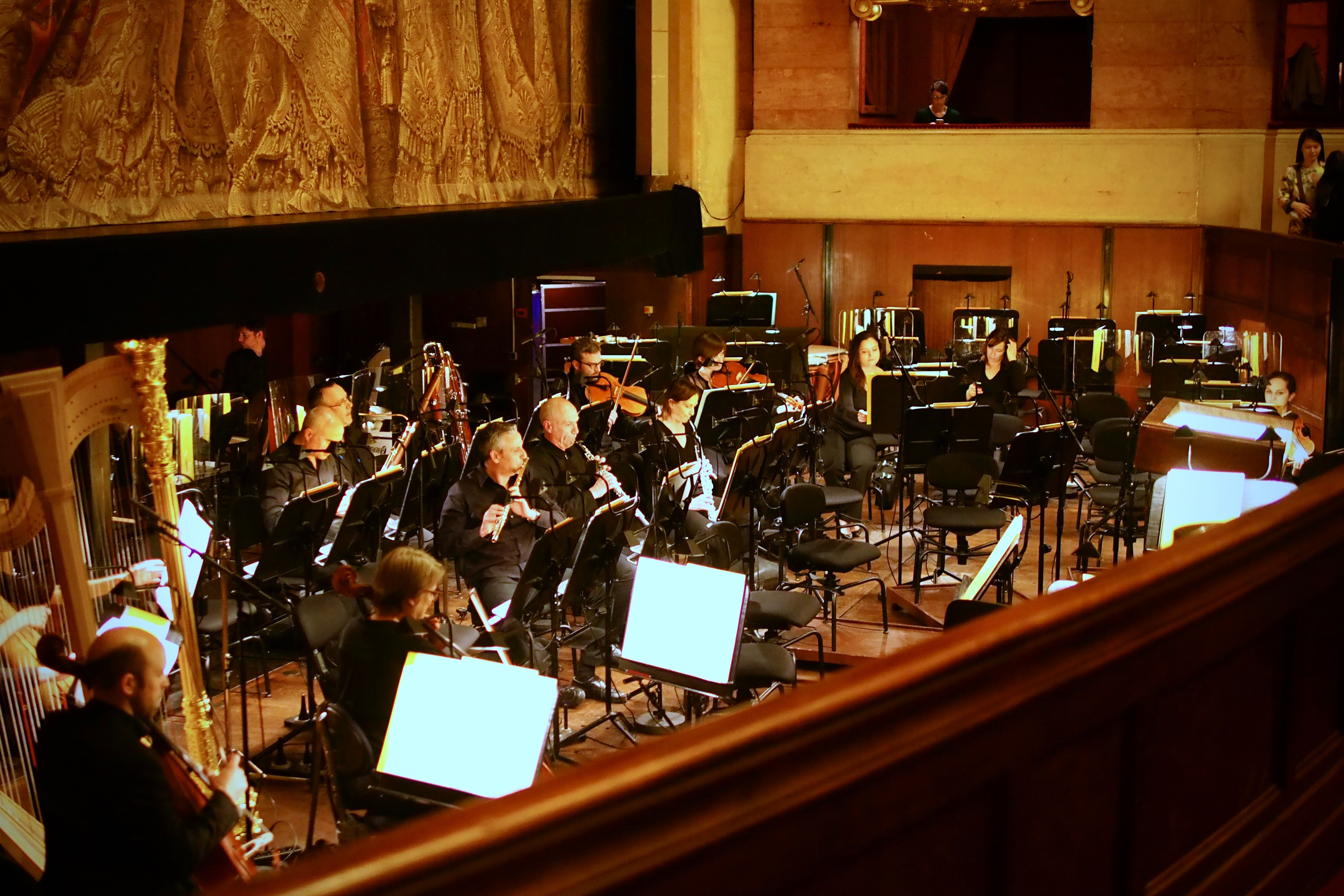 Orchestra in the pit of a theater.